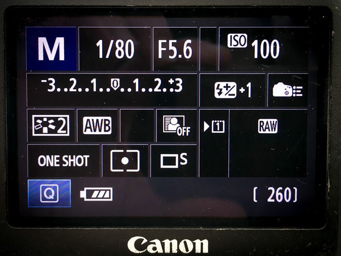 A close up shot of changing camera settings on manual mode 